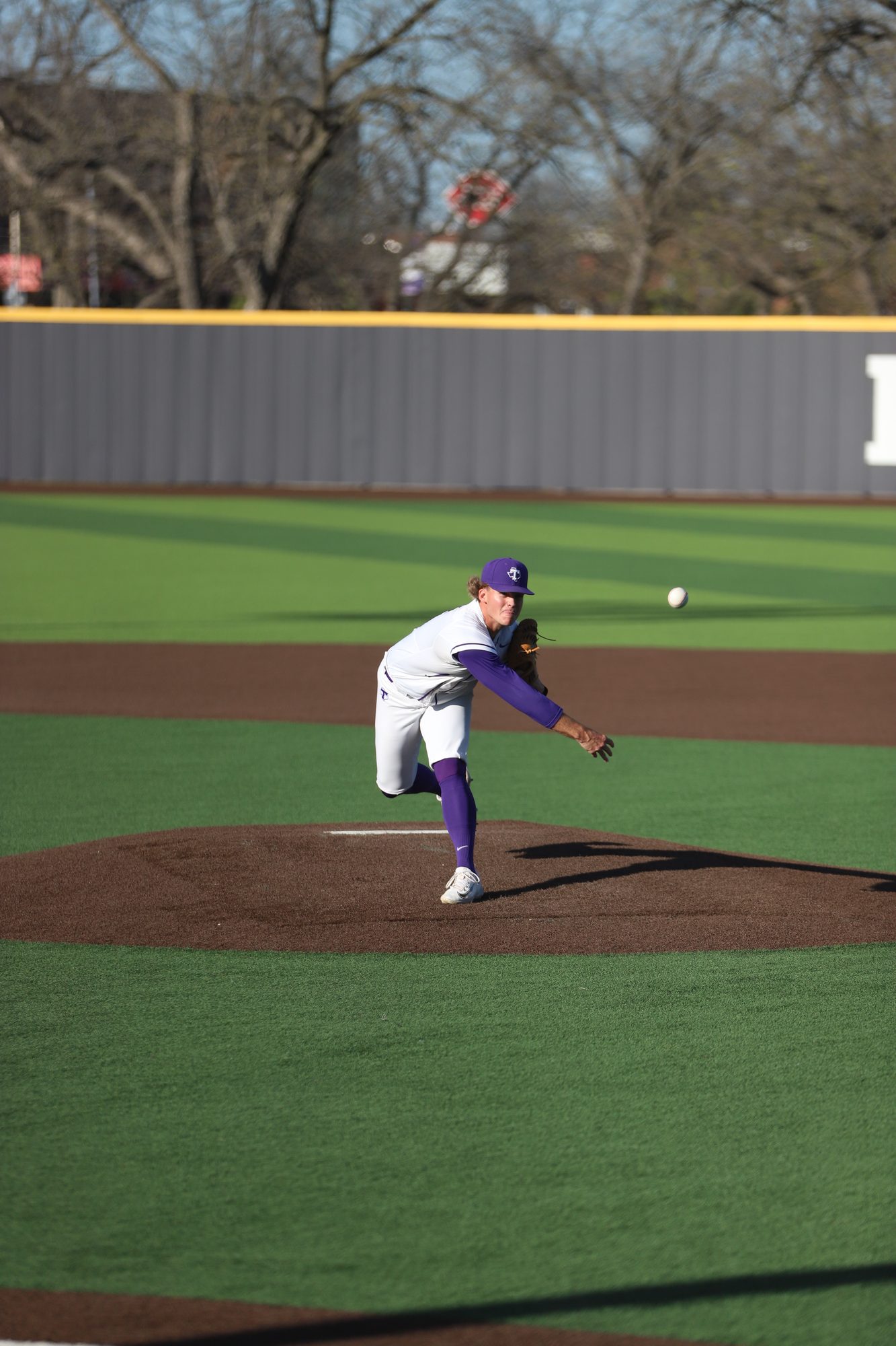 Pitcher delivering a pitch