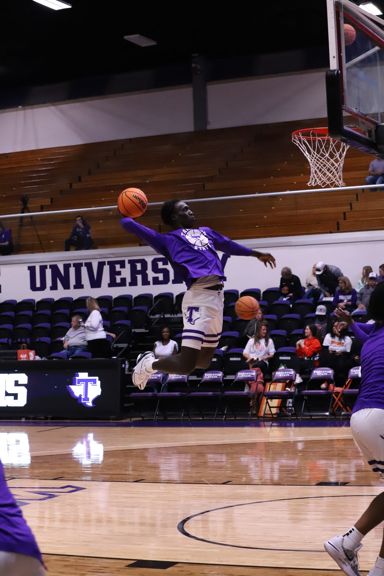 Basketball player going up for a layup