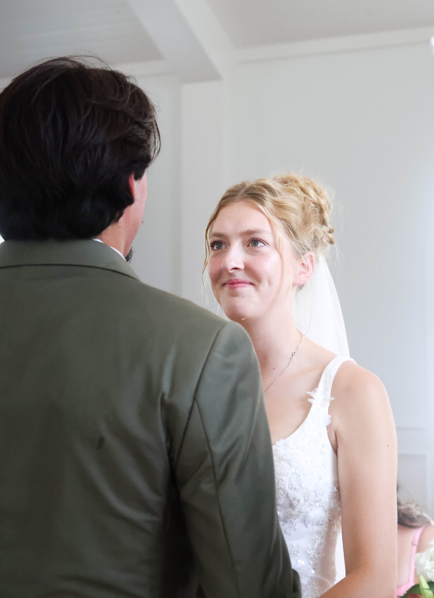 Bride smiling up at the groom