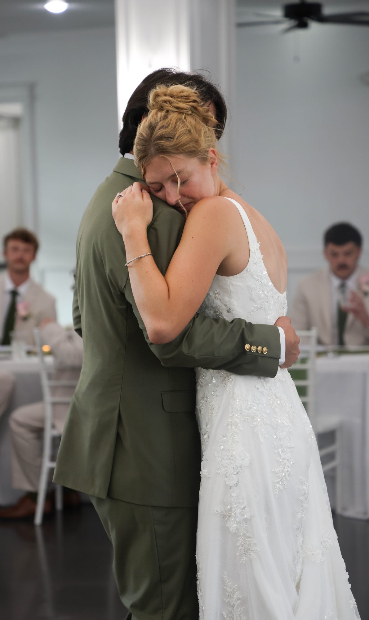 Bride and groom embracing during the reception